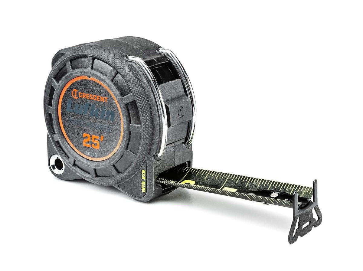 Angled product shot of the Crescent Lufkin L1125B-02 Shockforce Nite Eye tape measure with the matte black blade partially extended, showing the high-visibility green markings and the heavy-duty 360-degree endhook.