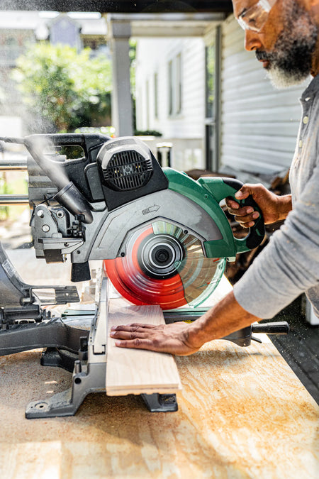 Crosscutting prefinished hardwood flooring cleanly with a Crescent 12-inch 80T FineCut blade on a compound miter saw.
