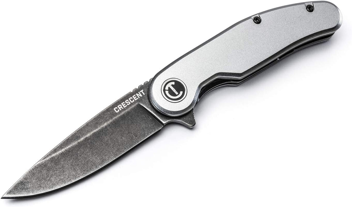 High-angle overhead product shot of the completely opened Crescent pocket utility knife, illustrating the smooth contours of the silver ergonomic aluminum handle and the dark textured finish of the high-tensile D2 tool steel blade.
