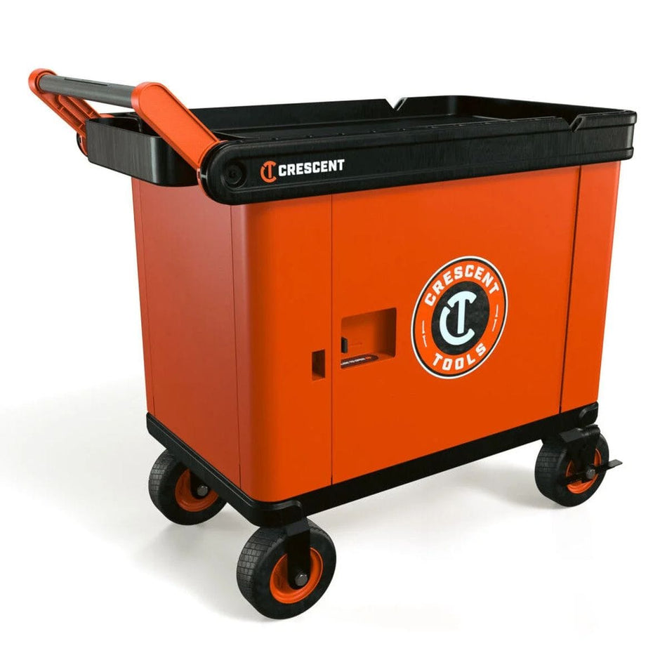 A professional product view of the Crescent RAILWORKS industrial utility cart featuring 8-inch heavy-duty semi-pneumatic casters and a high-visibility rawhide orange single-door lockable security panel for protected tool storage.