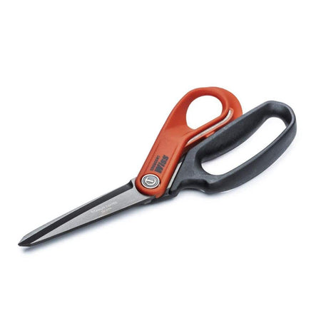 An angled studio shot of the Crescent Wiss tradesman shears highlighting the offset handle design that allows for easy tabletop cutting while keeping hands safely above the material.