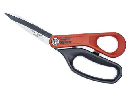 Top-down flat lay of the Crescent Wiss shears fully open, displaying the "Stainless Steel CW812S" marking on the blade and the orange and black handle construction.