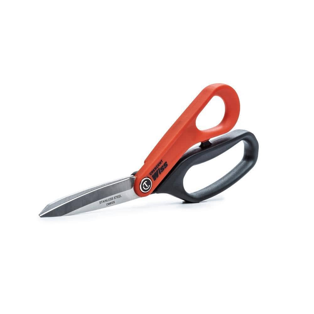 Studio shot of the closed shears resting on a surface, showcasing the compact profile and the prominent Crescent Wiss logo on the handle shank.