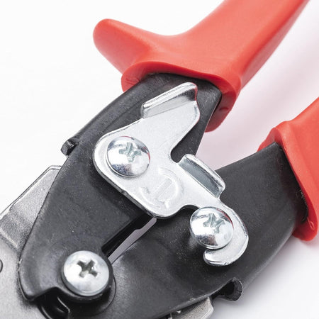 Close-up detail of the heavy-duty metal latch on the Crescent Wiss snips, demonstrating the ergonomic design that allows for easy, single-handed locking and unlocking by both left and right-handed users.