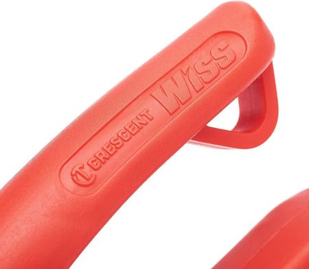A macro detail of the extended red non-slip handle grip, featuring the embossed Crescent Wiss logo and the textured material designed for superior comfort and control in professional environments.