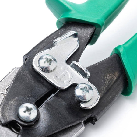 Detailed close-up of the central compound action pivot mechanism and the metal locking latch located between the green handles of the snips.