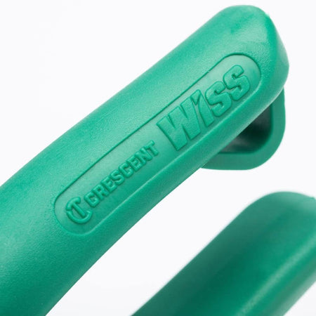 Close-up of the green non-slip grip handle showing the embossed CRESCENT WISS brand logo.