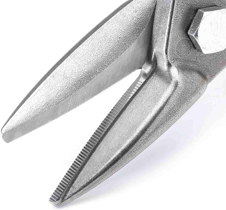 A detailed close-up of the CNC-ground serrated blades on the Crescent Wiss snips, illustrating the precision molybdenum edge designed for superior material control and clean cuts in 18-gauge steel.