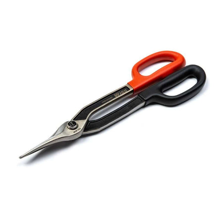 Close-up action shot of a professional using the Crescent Wiss duckbill snips to precisely cut a circular shape out of a piece of light-gauge galvanized sheet metal.