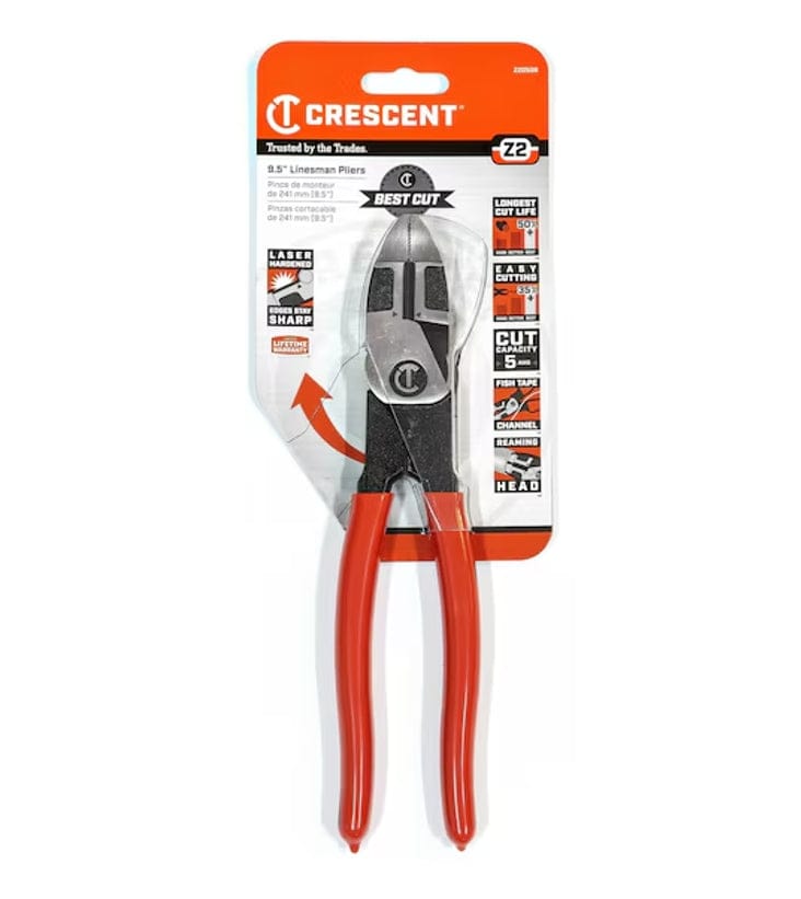 Packaged Crescent Z2 8.5-inch lineman pliers with red handles displayed in orange retail packaging. Labels highlight features like high leverage head, larger cutting zone, and ability to cut harder materials with less force.