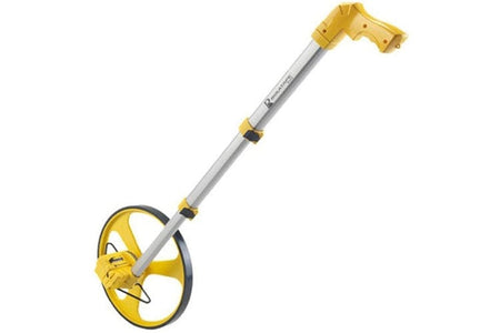 A side profile of the Cst/Berger RT312 measuring wheel, showing its large yellow spoked wheel, aluminum telescopic handle, and yellow ergonomic pistol grip.
