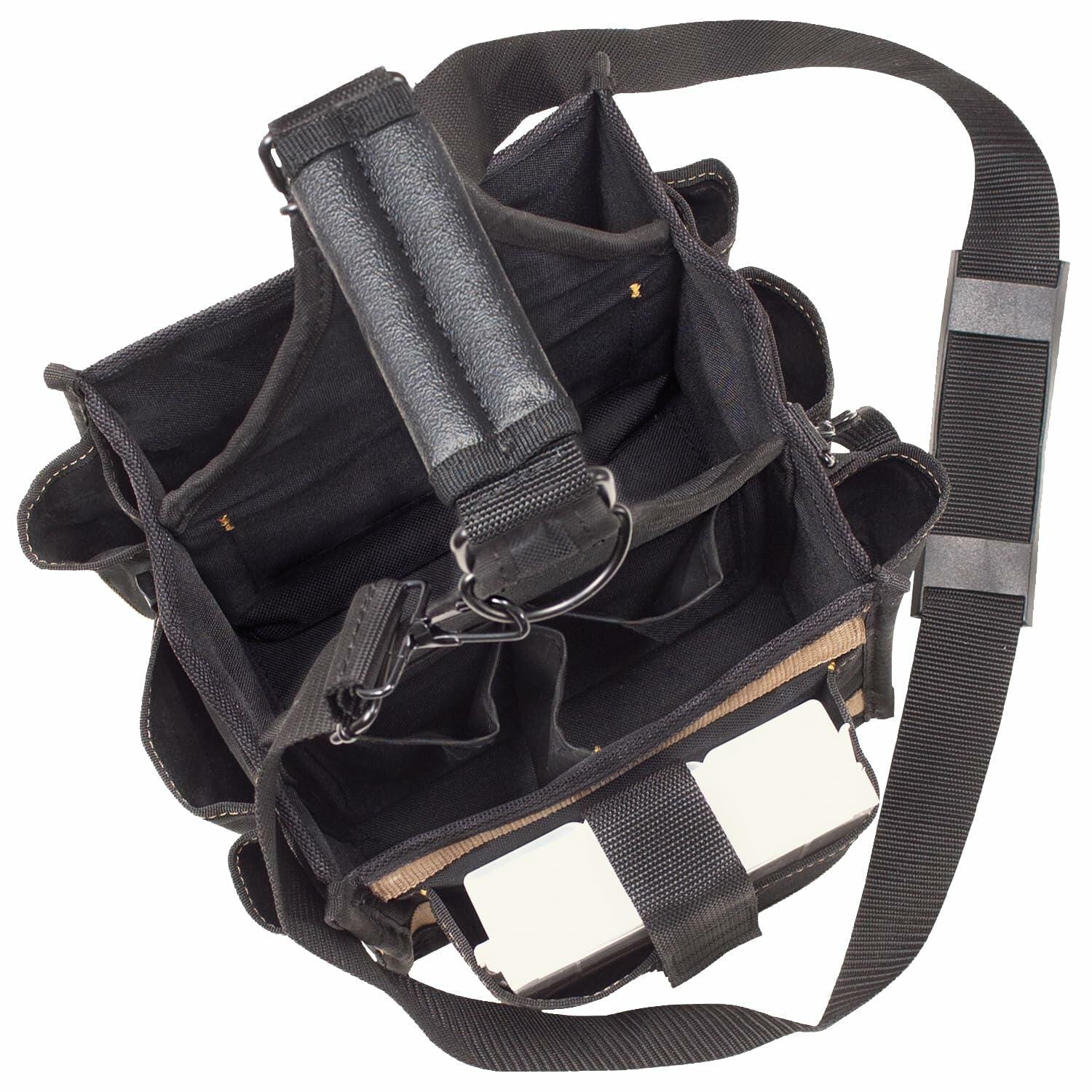 Overhead view of the open Custom Leathercraft 25-pocket tool carrier bag, showing the interior compartments, the padded carry handle, and the shoulder strap.