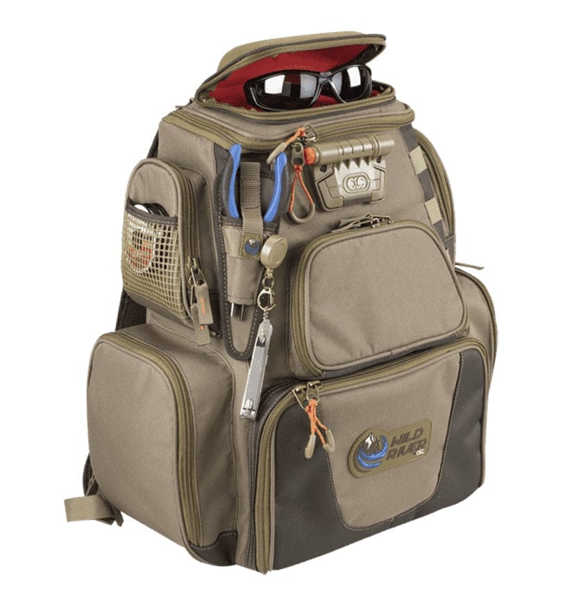 Tan and brown Wild River fishing backpack with LED light system, pliers in front loops, retractable lanyard, and sunglasses stored in the top compartment. Multiple zippered pockets and mesh holders support organized outdoor gear access.