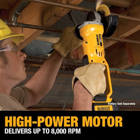 Worker using DEWALT DCG412B angle grinder to cut metal pipe in a construction setting; sparks and safety gear emphasize high-power motor performance.