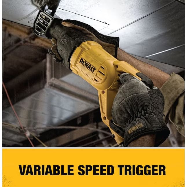Worker using DEWALT reciprocating saw to cut metal in an industrial setting, with text “VARIABLE SPEED TRIGGER” shown on a yellow banner.