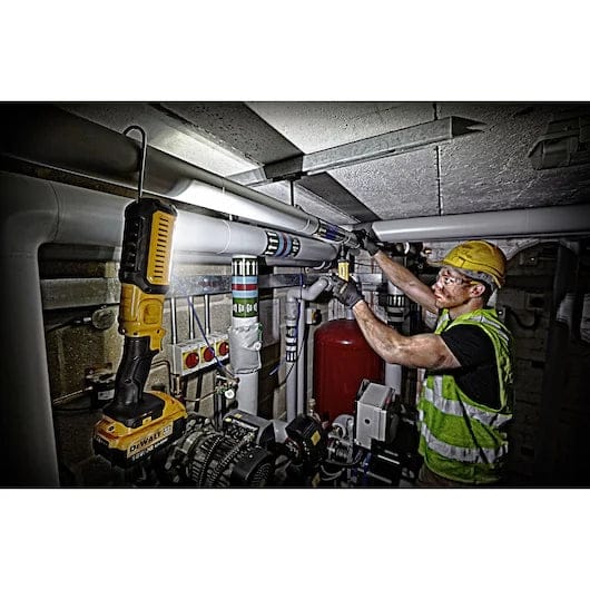 uKrf4bTsQy2DpbxgfMGfe.jpeg
Worker wearing safety gear uses a DEWALT cordless drill to install or maintain piping in an industrial setting with labeled pipes and mechanical components.
