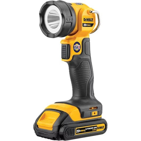 DEWALT 20V MAX* LED Work Light/Flashlight This image displays a DeWalt brand cordless LED work light standing upright against a white background. The tool is primarily bright yellow, with black rubber grips on the handle and around the circular light head. The light head is positioned at the top, facing slightly upwards and forwards, mounted on a body that resembles a drill handle sitting on a flat battery base.