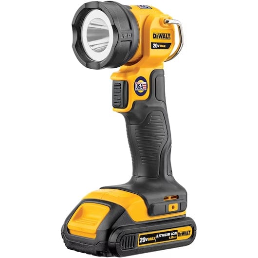 DEWALT 20V MAX* LED Work Light/Flashlight This image displays a DeWalt brand cordless LED work light standing upright against a white background. The tool is primarily bright yellow, with black rubber grips on the handle and around the circular light head. The light head is positioned at the top, facing slightly upwards and forwards, mounted on a body that resembles a drill handle sitting on a flat battery base.