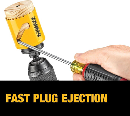 Close-up of DEWALT hole saw with a hand using a screwdriver to eject a wooden plug, emphasizing fast plug ejection feature during active drilling.