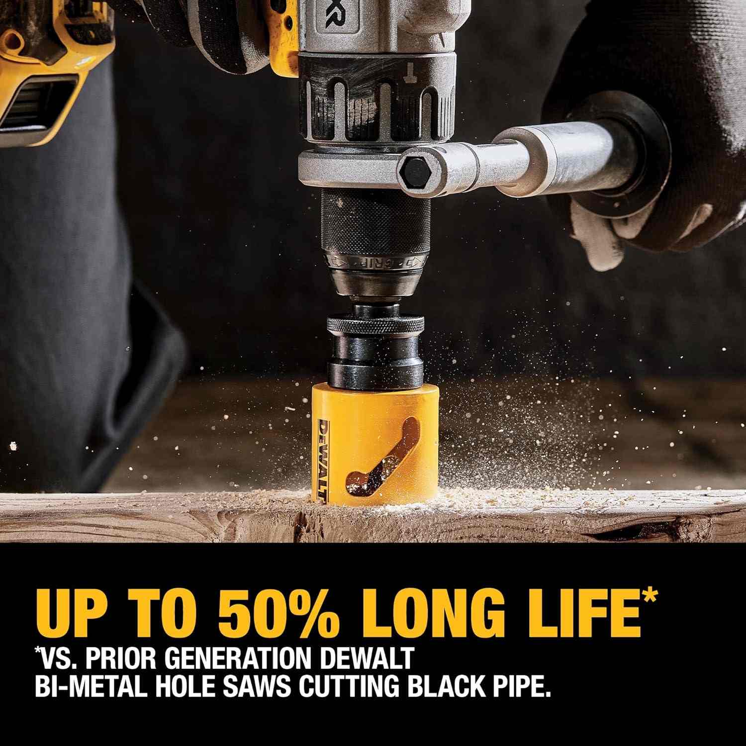 Close-up of DEWALT hole saw attached to a drill cutting through black pipe or wood, with sawdust flying, highlighting active use and long-life performance