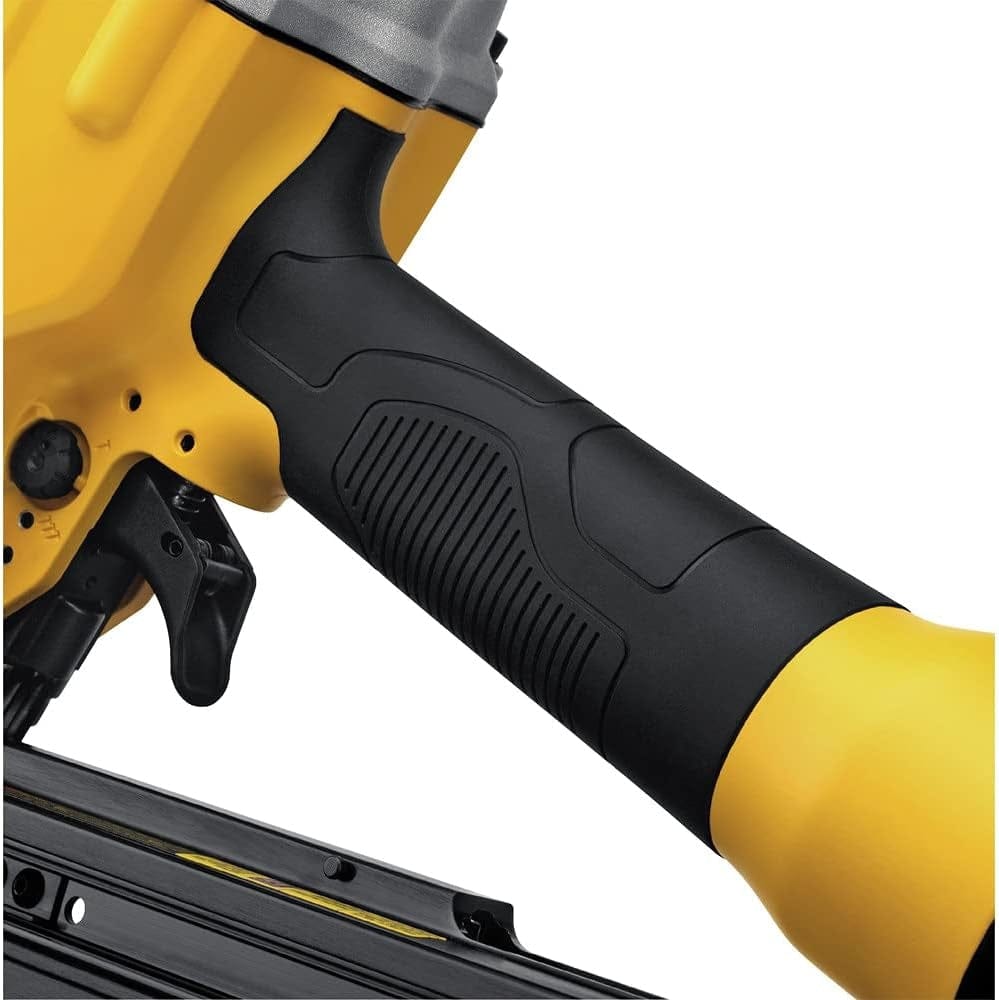 Close-up of DEWALT nail gun handle with textured grip, showing trigger and part of nail magazine, built from metal and high-impact plastic.