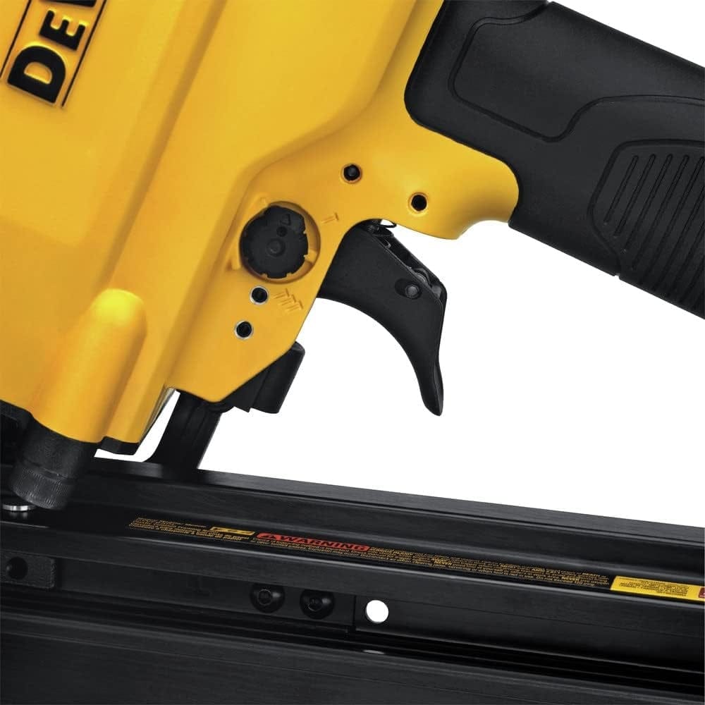 Detailed view of DEWALT nail gun showing trigger, adjustment dial, and nail magazine, highlighting ergonomic design and control features