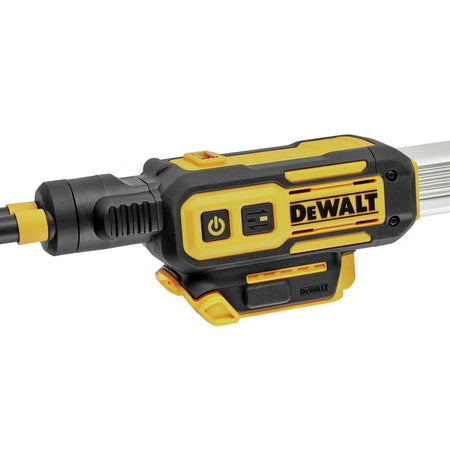 Detail view of DEWALT power tool motor housing, possibly part of a pole saw or lighting system. Features include a power button, textured grip, and yellow and black casing with DEWALT branding.