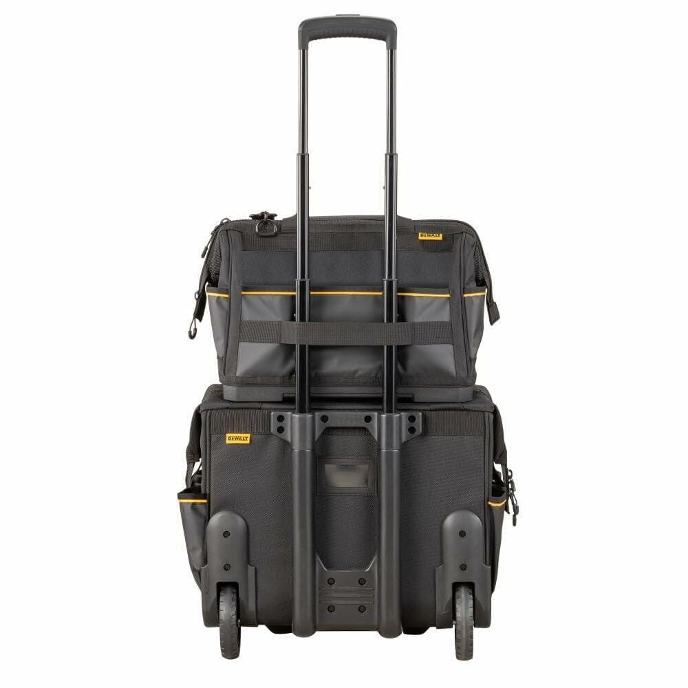 The back of the DEWALT Pro Tool Bag, showing its integrated strap being used to hang it securely on the telescoping handle of a rolling tool case.