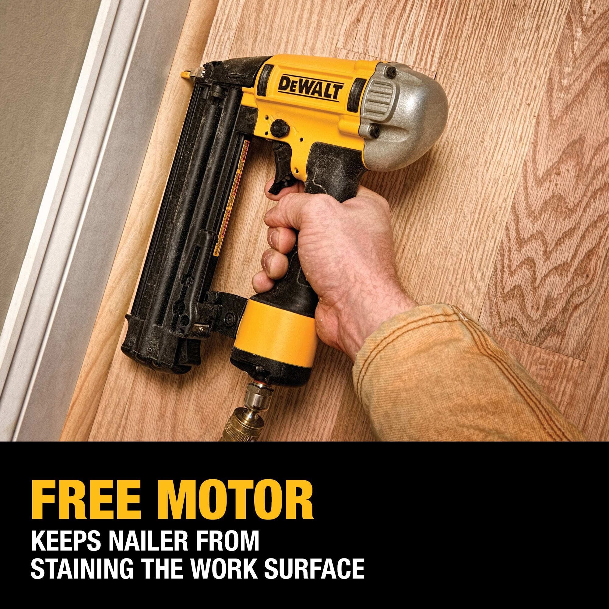 Close up shot of a contractor using the DEWALT 18 gauge brad nailer on wood flooring highlighting the maintenance free motor that prevents oil from staining the work surface.