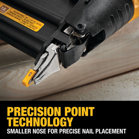 Macro view of the DEWALT Precision Point technology smaller nose and yellow no-mar tip being used for high-visibility and exact 18 gauge brad nail placement on a wood surface.
