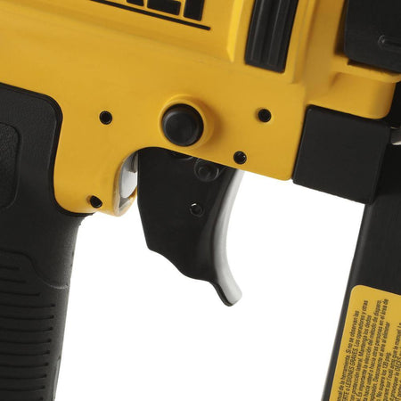 Close up view of the selectable trigger on the DEWALT finish nailer allowing users to easily switch between sequential and contact actuation modes.
