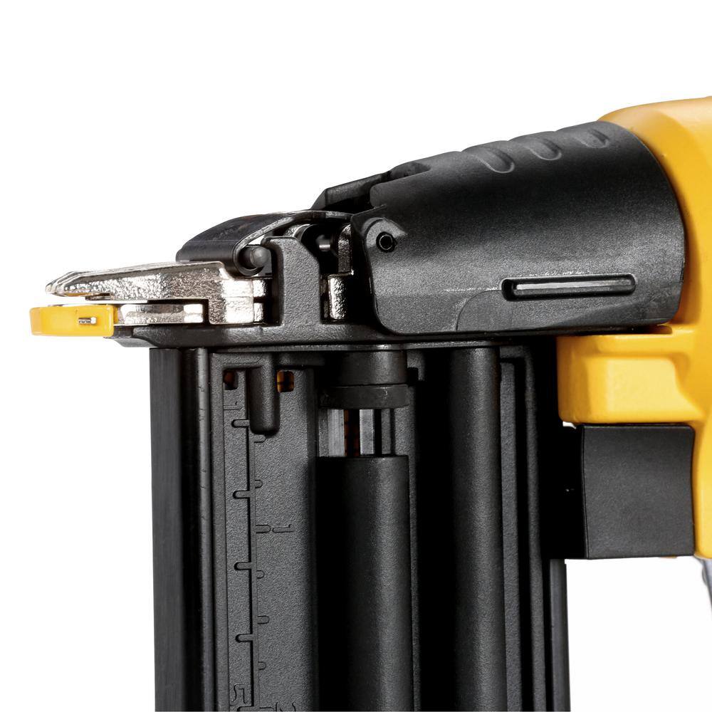 Technical shot of the top of the DEWALT pneumatic nailer highlighting the tool-free jam release lever for quick clearing of fasteners during trim work.