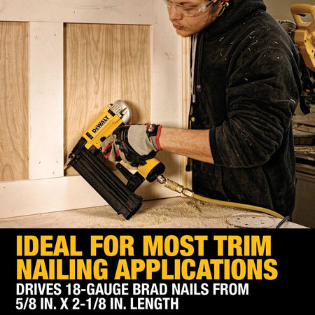 Action shot of a carpenter using the DEWALT Precision Point brad nailer for interior trim application demonstrating the tool's 18 gauge fastening range on a wood wall panel.