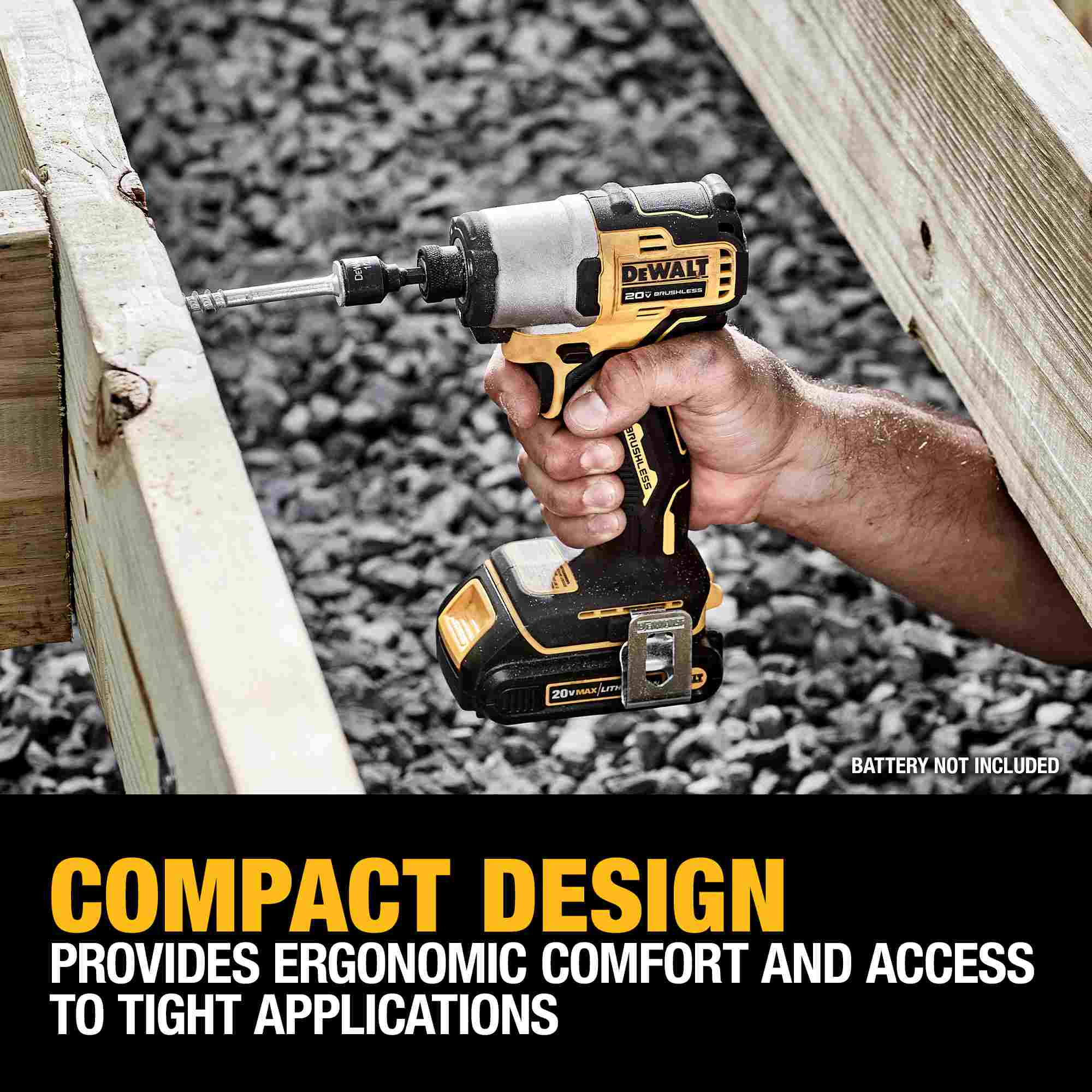 The DEWALT ATOMIC impact driver being used to drive a lag bolt into deck joists, emphasizing the compact design and ergonomic comfort for difficult fastening applications.