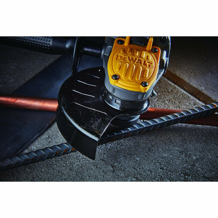 A close-up of a DEWALT angle grinder poised to cut through steel rebar.