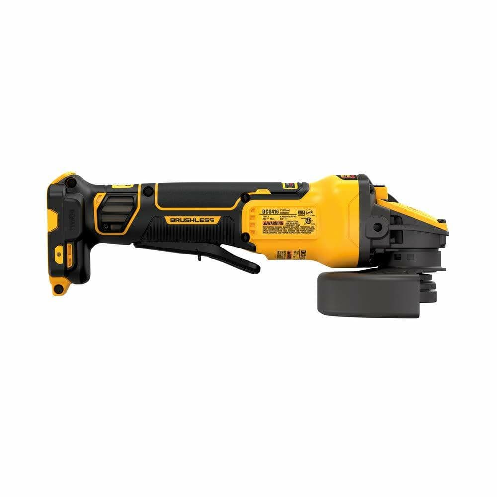 The underside view of the DEWALT 20V MAX Angle Grinder, showing the product information and safety warning labels.