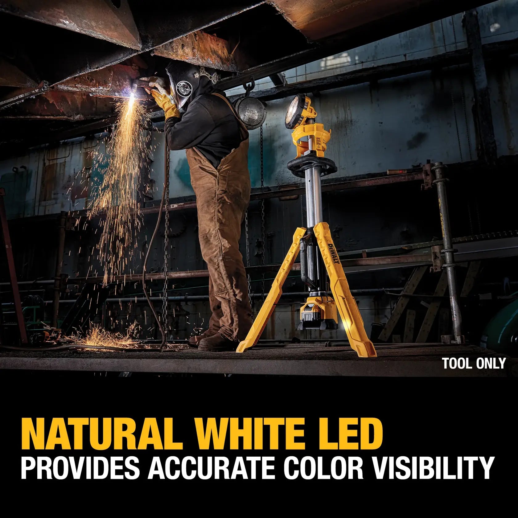 An action lifestyle shot of a welder working in a dark industrial setting illuminated by the DEWALT tripod light. A text overlay states Natural White LED Provides Accurate Color Visibility, showcasing the light’s ability to provide high-fidelity brightness in professional environments.