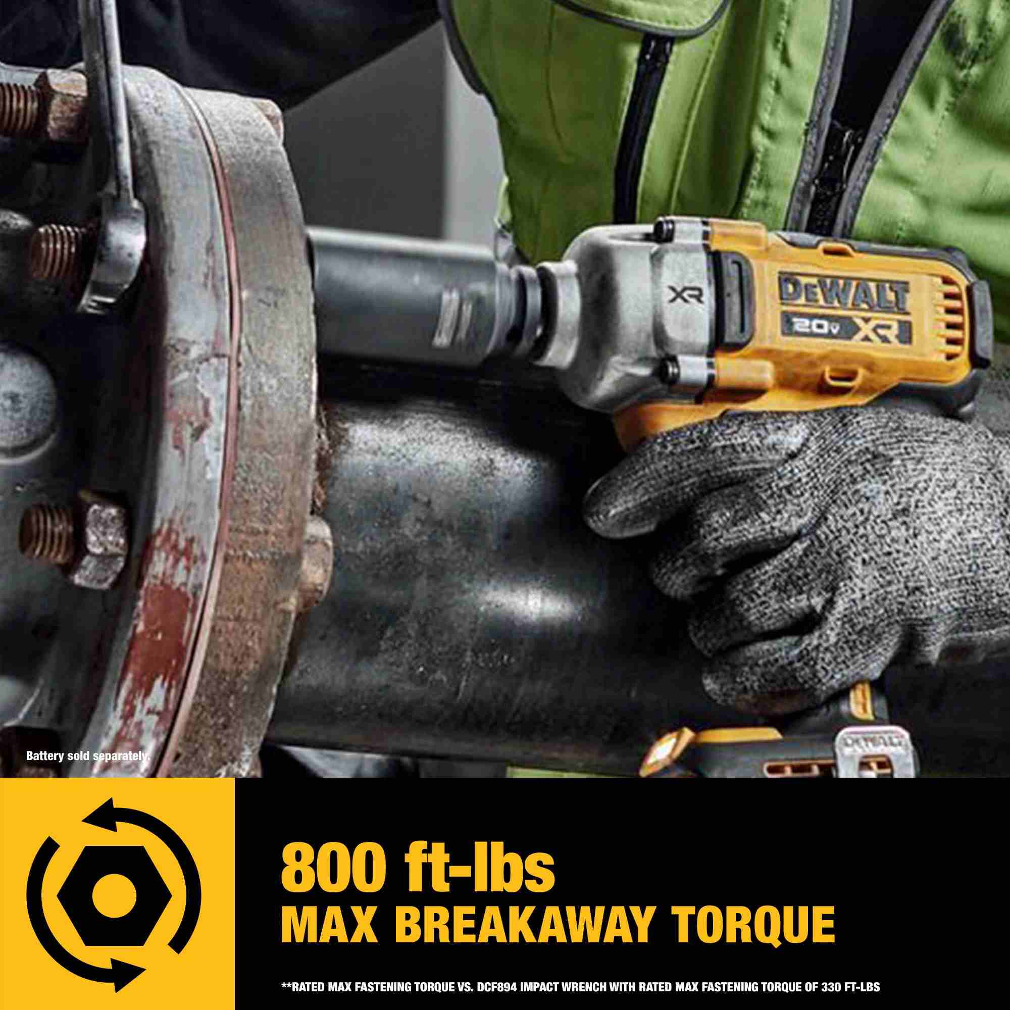 Action shot demonstrating the DEWALT impact wrench providing 800 ft-lbs of max breakaway torque to loosen a large industrial pipe flange bolt in a heavy-duty mechanical application.