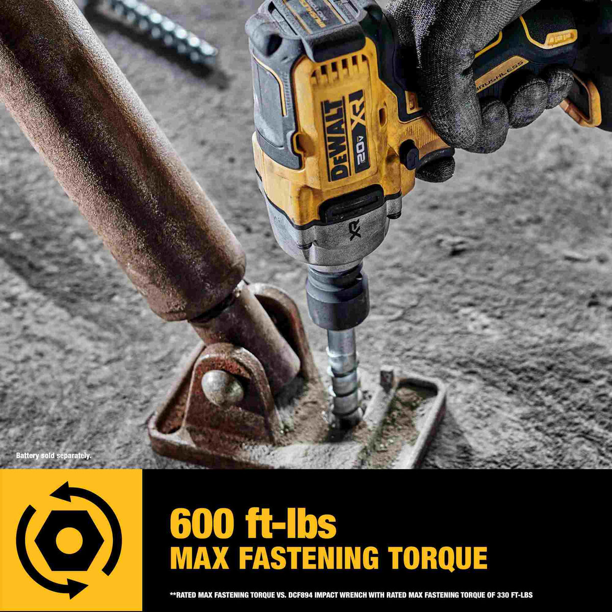 Jobsite action photo of the DEWALT 20V MAX XR impact wrench delivering 600 ft-lbs of max fastening torque to secure a large concrete anchor bolt into a structural base plate.