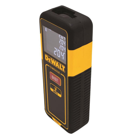 Rear angled view of the compact DEWALT DW065E measuring tool emphasizing the ergonomic textured grip and slim profile for easy single-handed operation during construction layout tasks.