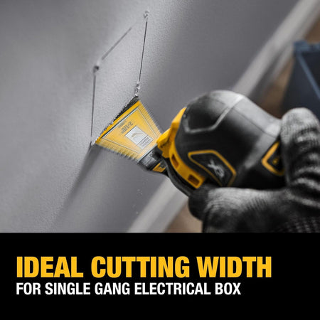 Action shot of a worker using a DEWALT 2-1/8 inch 3-sided oscillating blade to cut a precision opening for a single gang electrical box in drywall.