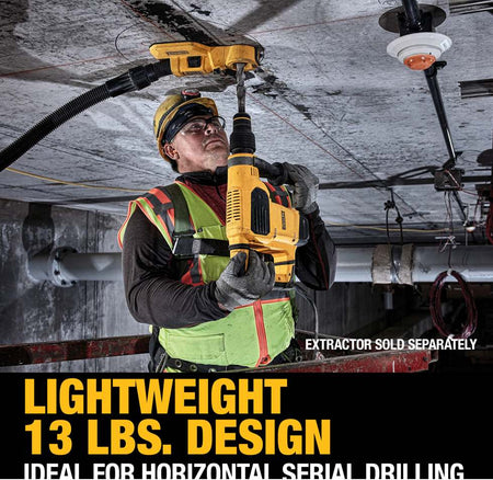 Construction worker using DEWALT rotary hammer drill for overhead concrete drilling with dust extractor hose attached. Safety gear and industrial setting visible.
