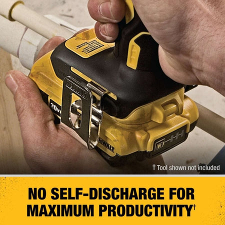 A side view of a DEWALT 18V cordless drill with the 20V MAX battery adapter and a DCB203 battery installed, including a warning label advising users to remove the battery from the adapter when the tool is not in use.