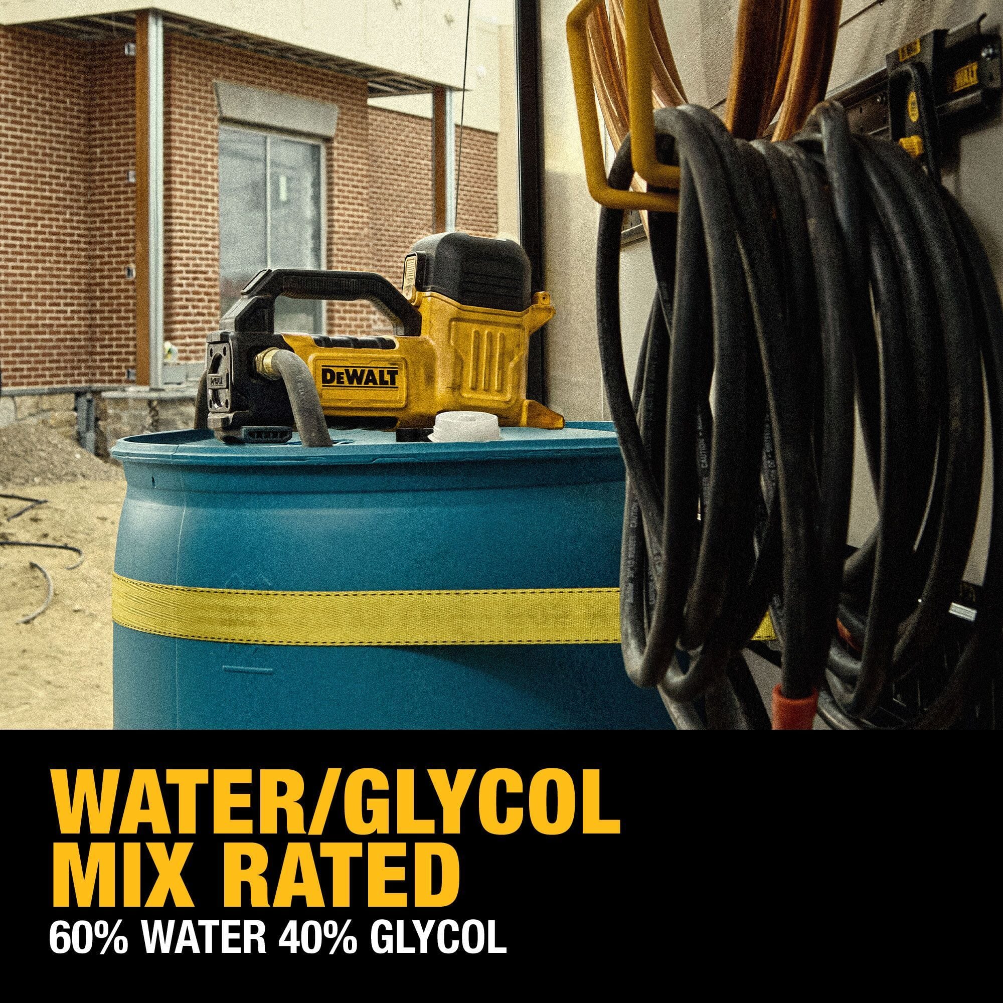 DEWALT 20V MAX cordless transfer pump sitting on top of a large blue plastic fluid drum at a construction site jobsite. Text reads Water/glycol mix rated 60% water 40% glycol for specialized HVAC plumbing fluid transfer.