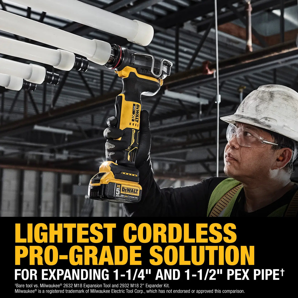 Action shot of a professional plumber using the DEWALT 20V MAX XR PEX expander to install 1-1/4 inch tubing in a commercial overhead environment.