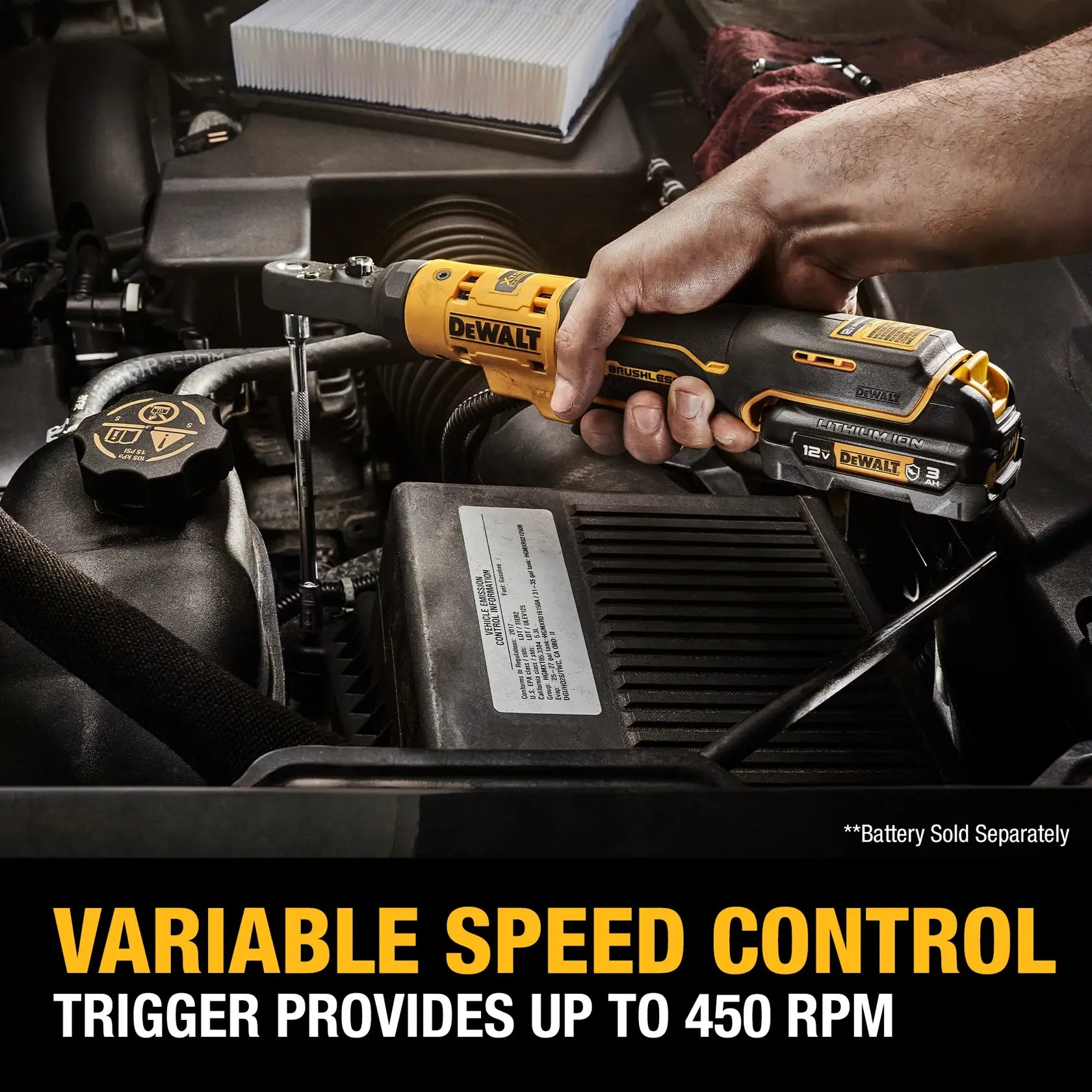 Action shot of a mechanic using the DEWALT XTREME brushless ratchet to remove a bolt inside a vehicle engine bay, highlighting the variable speed control up to 450 RPM.