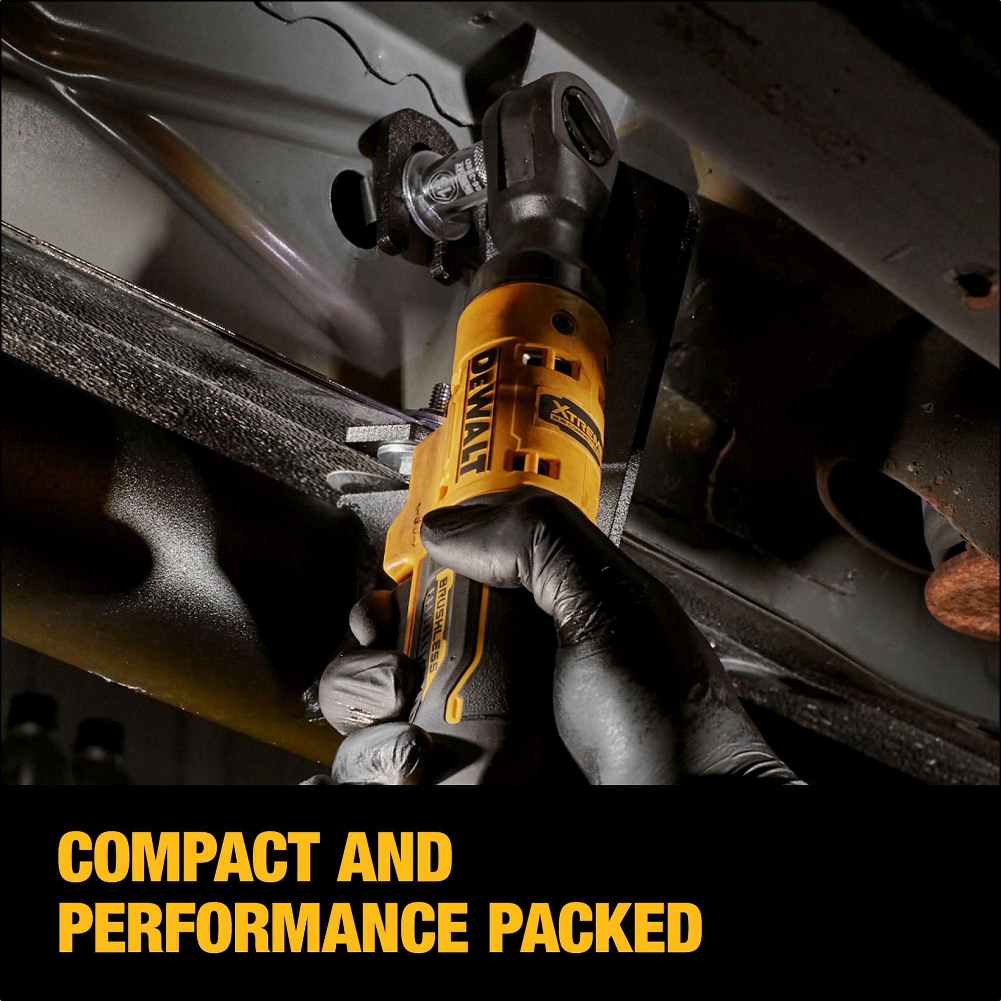 Action shot of a mechanic using the DEWALT XTREME cordless 3/8-inch ratchet to fasten a bolt in a narrow automotive chassis gap, with an overlay highlighting its compact and performance-packed design.