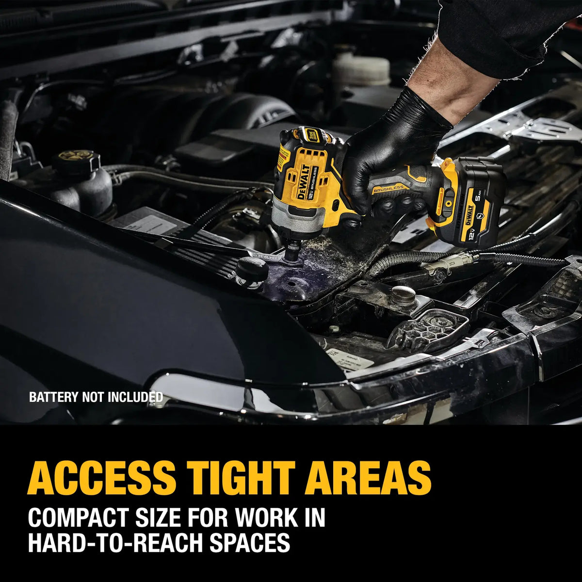 Automotive technician using the DEWALT XTREME 12V MAX brushless impact wrench to remove a bolt under the hood of a car, emphasizing its compact size for hard-to-reach engine spaces.