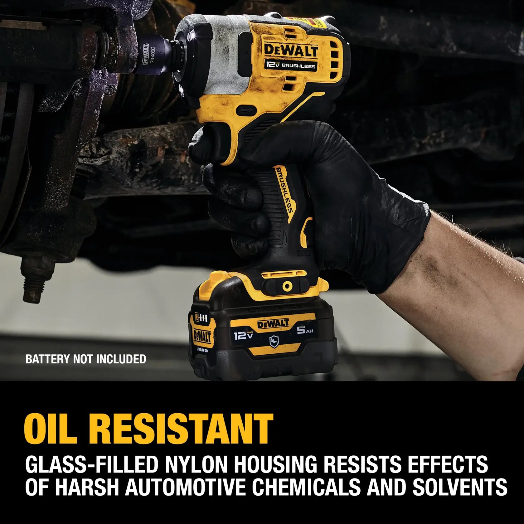 Professional mechanic in black nitrile gloves utilizing the DEWALT cordless 1/2-inch impact wrench on a vehicle chassis, highlighting the oil-resistant glass-filled nylon housing.
