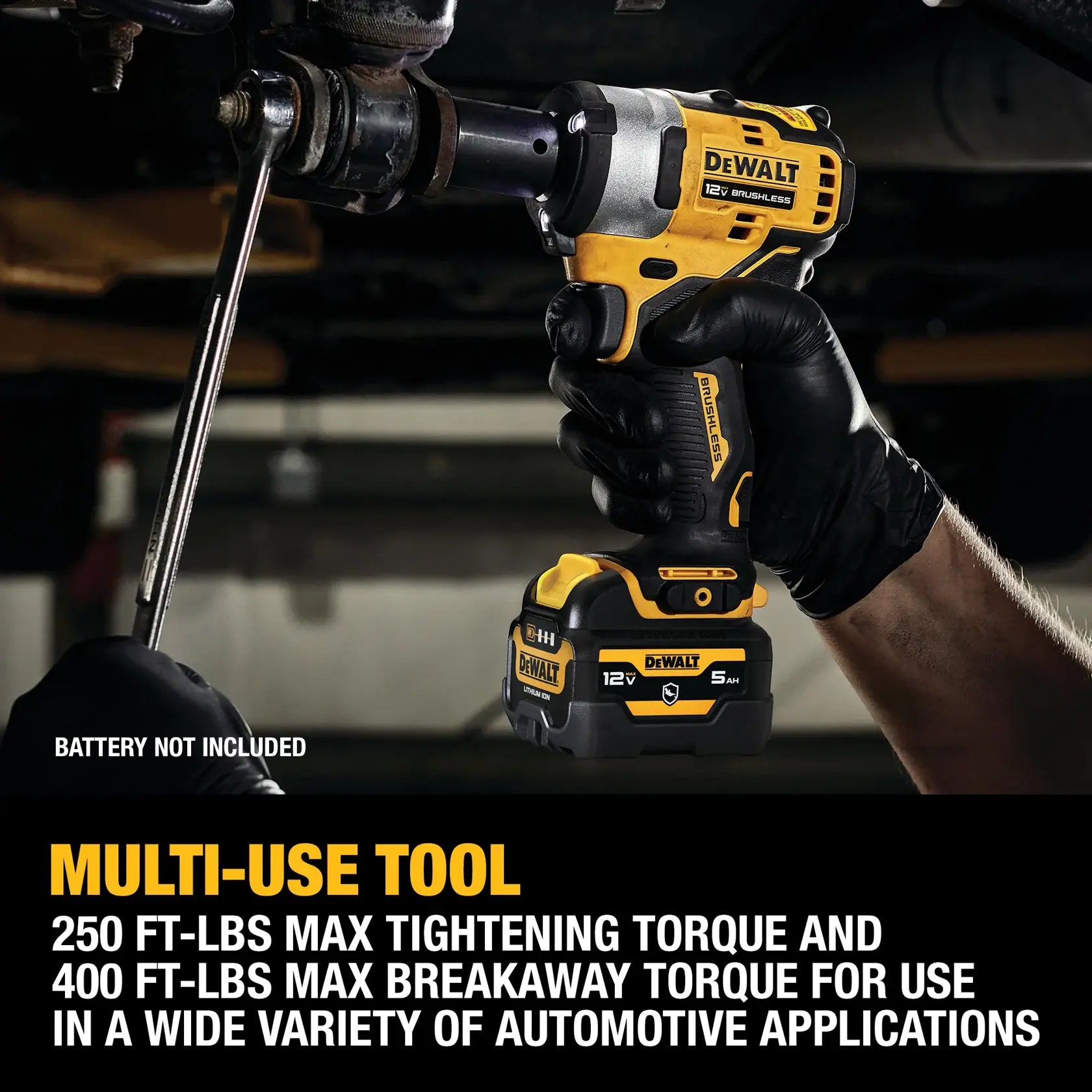Action shot of the DEWALT DCF901B cordless impact wrench breaking loose a stubborn suspension bolt, with a text overlay noting its high-torque multi-use capabilities.